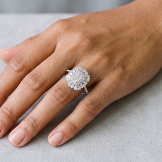 0.5 ct Emerald-Cut Baguette Sunburst Halo Moissanite Ring in sterling silver, worn on hand