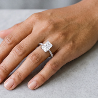 1 ct Radiant-Cut Solitaire on Pavé Band Moissanite Ring in sterling silver, worn on hand
