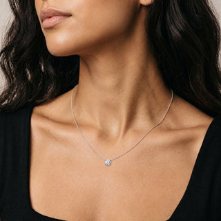 7mm Round Solitaire Moissanite Necklace in sterling silver, worn on model