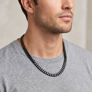 Superior Silver 8mm Miami Cuban link chain in black rhodium over 925 sterling silver worn by a man in a grey t-shirt