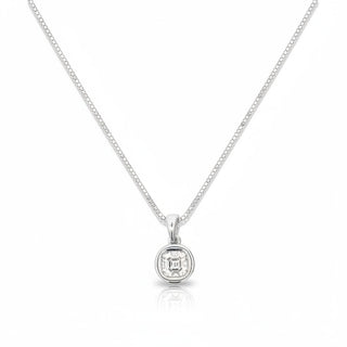 A silver box chain necklace with a small round bezel-set square-cut gemstone pendant, displayed on a clean white background with a subtle reflection.