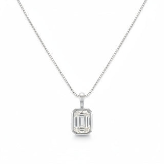 A silver necklace with a rectangular emerald-cut clear gemstone pendant, displayed on a clean white background.