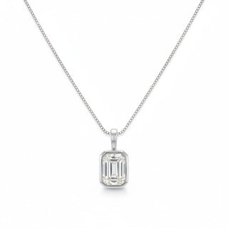 A silver necklace with a rectangular emerald-cut clear gemstone pendant, displayed on a clean white background.