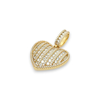 A gold heart-shaped pendant encrusted with small clear stones, set against a plain white background.