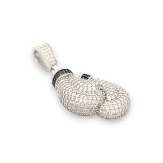 A silver-toned pendant shaped like a pair of boxing gloves, heavily paved with clear stones and accented with small black stones, shown on a plain white background.
