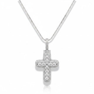 A silver cross pendant necklace paved with small clear stones, hanging from a silver box chain against a white background.