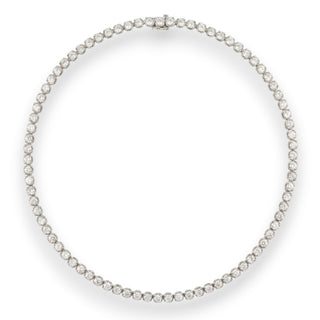 A diamond tennis necklace with a silver-toned clasp, displayed on a clean white background.