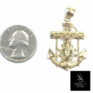 Anchor 10K Yellow Gold Pendant size comparison next to a US quarter