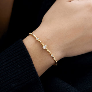 Beaded Five-Station Moissanite Bangle in Sterling Silver worn on the wrist