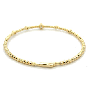 Beaded five-station moissanite bangle in yellow gold vermeil over sterling silver