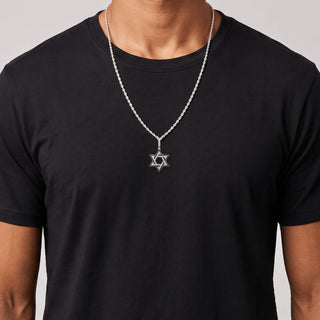 Black and White Star of David Moissanite Pendant in sterling silver, worn on model