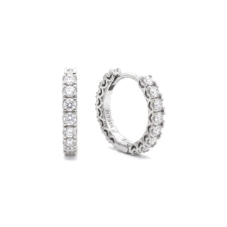 Bold prong-set round moissanite huggie hoop earrings in sterling silver