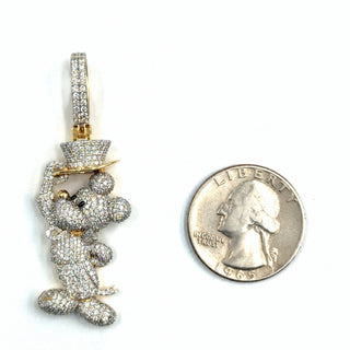Superior Silver cartoon mouse pendant in 10K yellow gold covered in 2.88ct natural diamonds next to a US quarter.