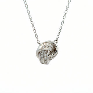 Channel-set love knot moissanite necklace in sterling silver, view 2