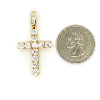 Medium classic prong-set moissanite cross pendant in yellow gold vermeil, shown beside a US quarter for scale