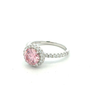 Colored center halo on pavé band moissanite ring in sterling silver with a pink center stone