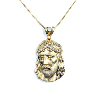 Superior Silver 10K yellow gold Jesus pendant featuring a crown of thorns accented with sparkling CZ stones.