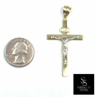 Crucifix Jesus on Cross 10K Yellow Gold Pendant size comparison next to a US quarter