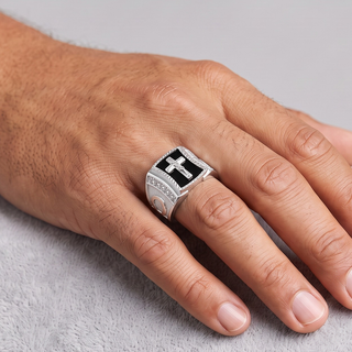 Crucifix on Black Onyx Signet with Channel Sides Moissanite Ring in sterling silver, worn on hand