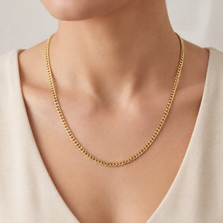 Superior Silver 18-inch curb link chain in 14kt yellow gold over 925 sterling silver worn on a model