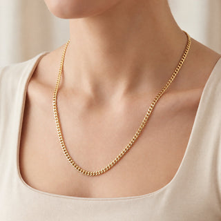 Superior Silver 20-inch curb link chain necklace in 14kt yellow gold over solid 925 sterling silver on a model
