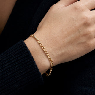 Curb Link Bracelet 10K Yellow Gold 7.5inch/3.0mm worn on the wrist