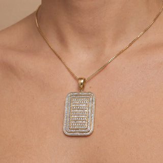 Superior Silver dog tag pendant in 10K yellow gold featuring 2 carats of baguette and round cut natural diamonds.