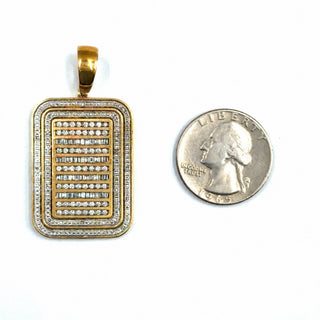 Superior Silver 10K yellow gold dog tag pendant featuring 2 CTW baguette and round natural diamonds next to a quarter.