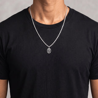Divine Mercy Oval Medal Moissanite Pendant in sterling silver, worn on model