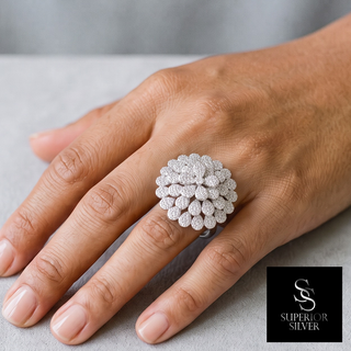 Domed Layered Pavé Flower Cocktail Moissanite Ring in sterling silver, worn on hand