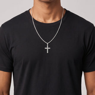 Double-Row Shared-Prong Latin Cross Moissanite Pendant in sterling silver, worn on model