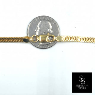 Flat Franco Chain 14kt Yellow Gold over 925 Sterling Silver 20inch 3.87mm closeup on quarter