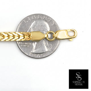 Flat Franco Chain 14kt Yellow Gold over 925 Sterling Silver 26inch 5.0mm closeup on quarter