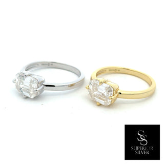 East-West emerald-cut solitaire moissanite ring in sterling silver and yellow gold vermeil, side by side