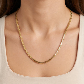 Superior Silver 18-inch flat Franco chain necklace in 14kt yellow gold over 925 sterling silver worn on a model