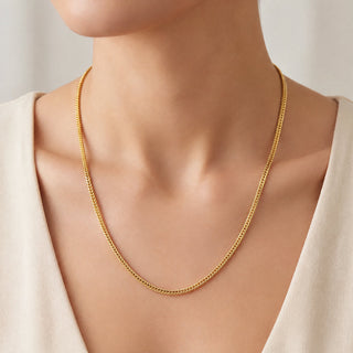 Superior Silver 20-inch flat Franco chain necklace in 14kt yellow gold over 925 sterling silver worn on a model