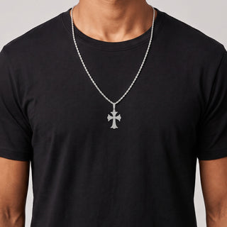 Fleur-Tip Cross with Pavé Medallion Center Moissanite Pendant in sterling silver, worn on model