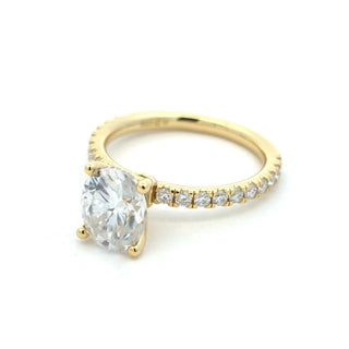 Four-Prong oval solitaire on pavé band moissanite ring in yellow gold vermeil over sterling silver