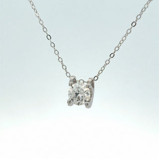 Four-prong round solitaire moissanite necklace in sterling silver