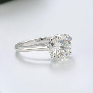 Four-Prong round solitaire on polished band moissanite ring in sterling silver, view 2