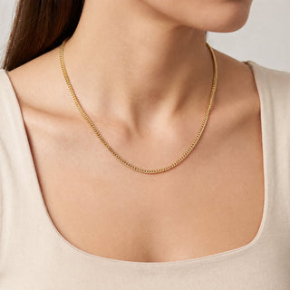 Superior Silver 22-inch 10K yellow gold Franco link chain worn around a woman's neck with a polished finish.