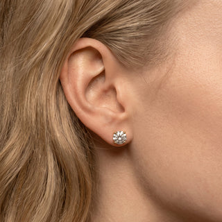 Gold vermeil 8mm round moissanite solitaire stud earrings shown on model