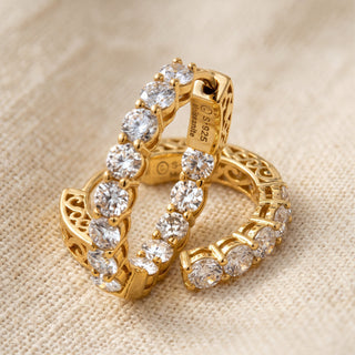 Close-up of gold vermeil inside out moissanite hoop showing stones on the inner face