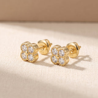 Gold vermeil beaded quatrefoil moissanite stud earrings, macro detail of the milgrain borders
