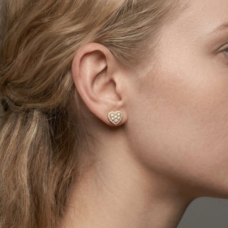 Gold vermeil pave cluster heart halo moissanite stud earrings shown on model