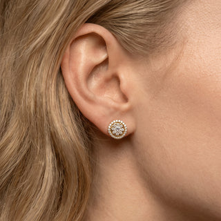 Model wearing gold vermeil flower cluster double halo moissanite stud earrings