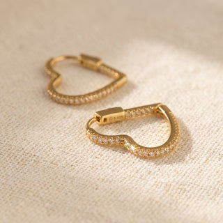 Close-up of the gold vermeil heart hoop showing the square-section band and hinged snap closure