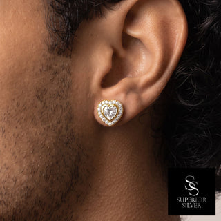 Heart cut bezel halo moissanite stud earrings in yellow gold vermeil over sterling silver, worn on model