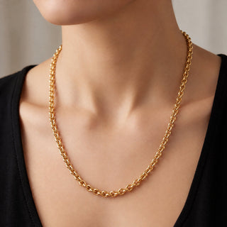 Superior Silver 20-inch solid 14K yellow gold heavy link chain necklace worn on a person with a black top.