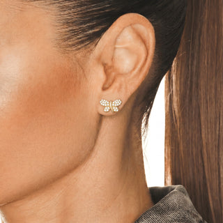 Iced Pavé Butterfly Moissanite Stud Earrings in yellow gold vermeil over sterling silver, worn on model